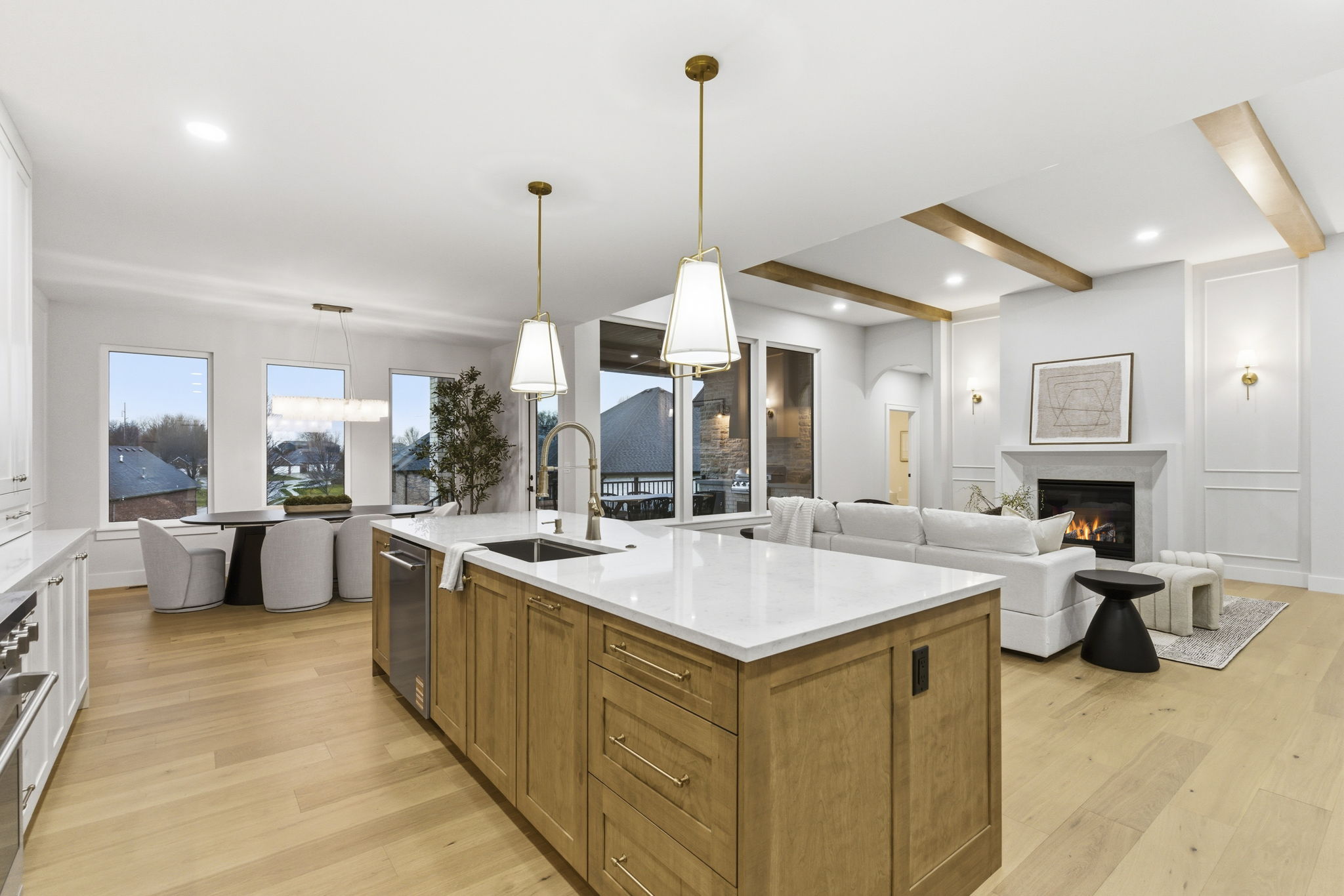Staged open kitchen, dining, and living area in Springfield, Missouri